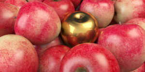 Golden apple in the middle of red apples. ( 3d render )